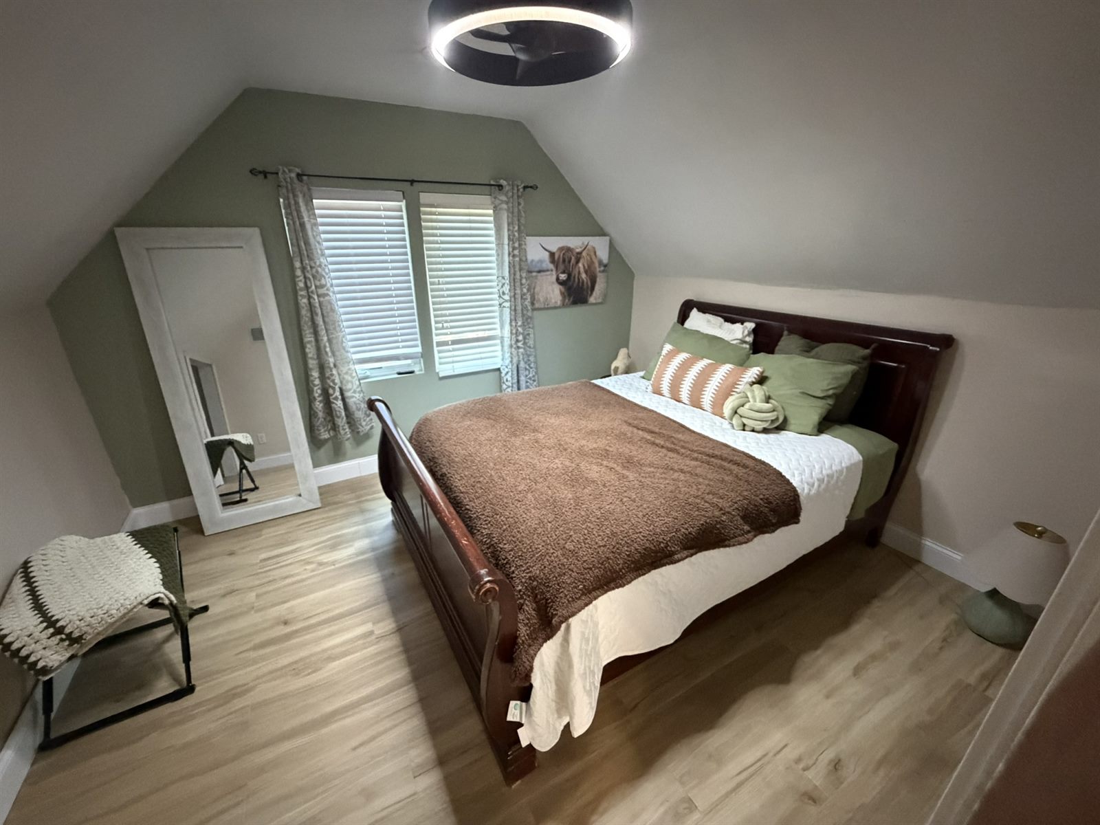 Bedroom in Rose's Barn Loft with a wood sleigh bed
