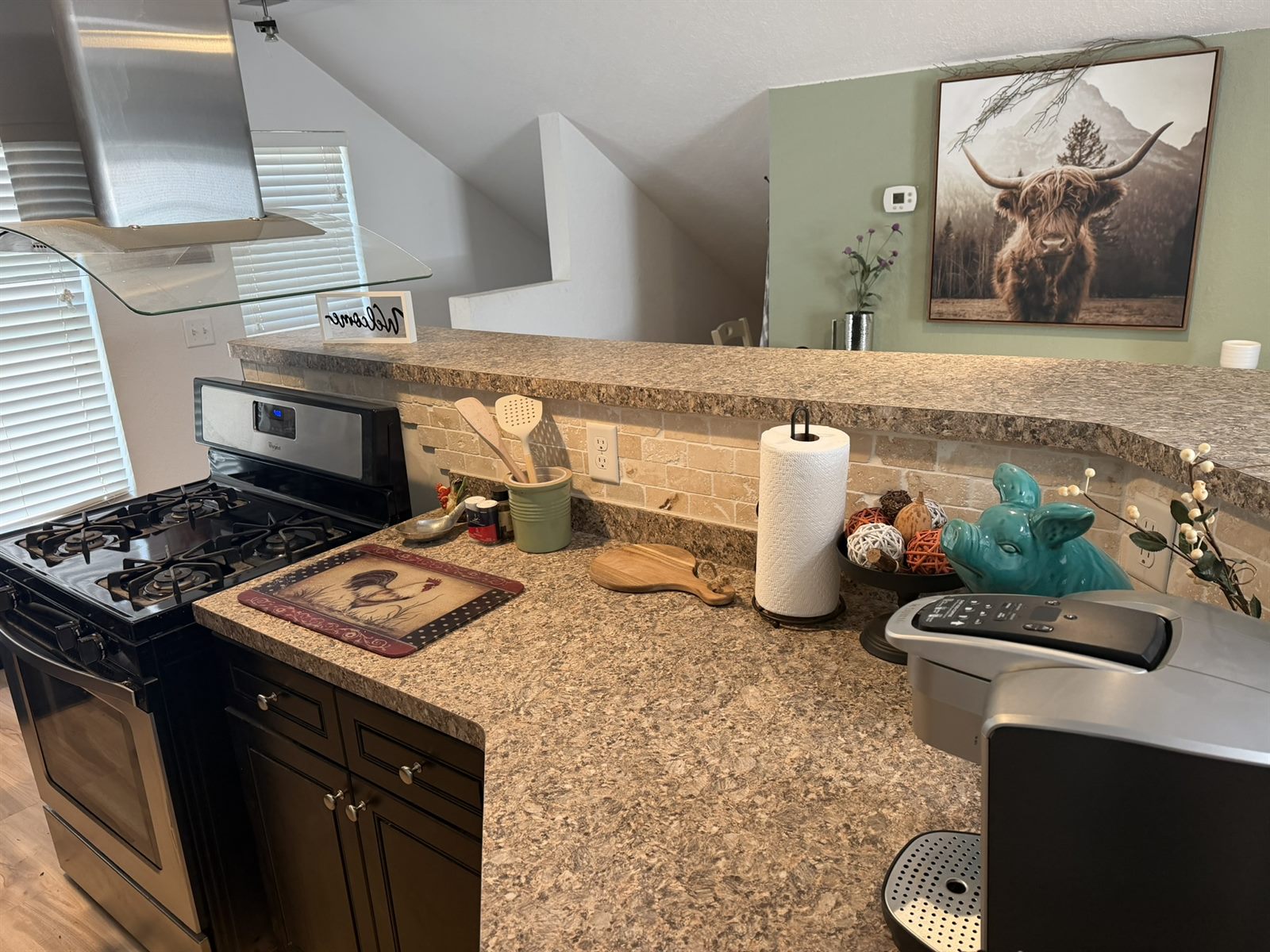 Kitchen in Rose's Barn Loft with granite counters and a gas range