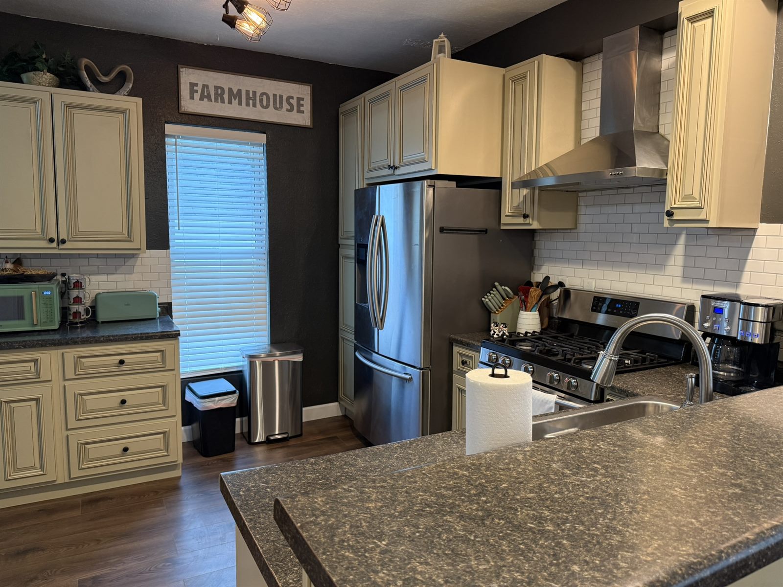 A warm, barn-inspired kitchen in one of the Rose's Village stays