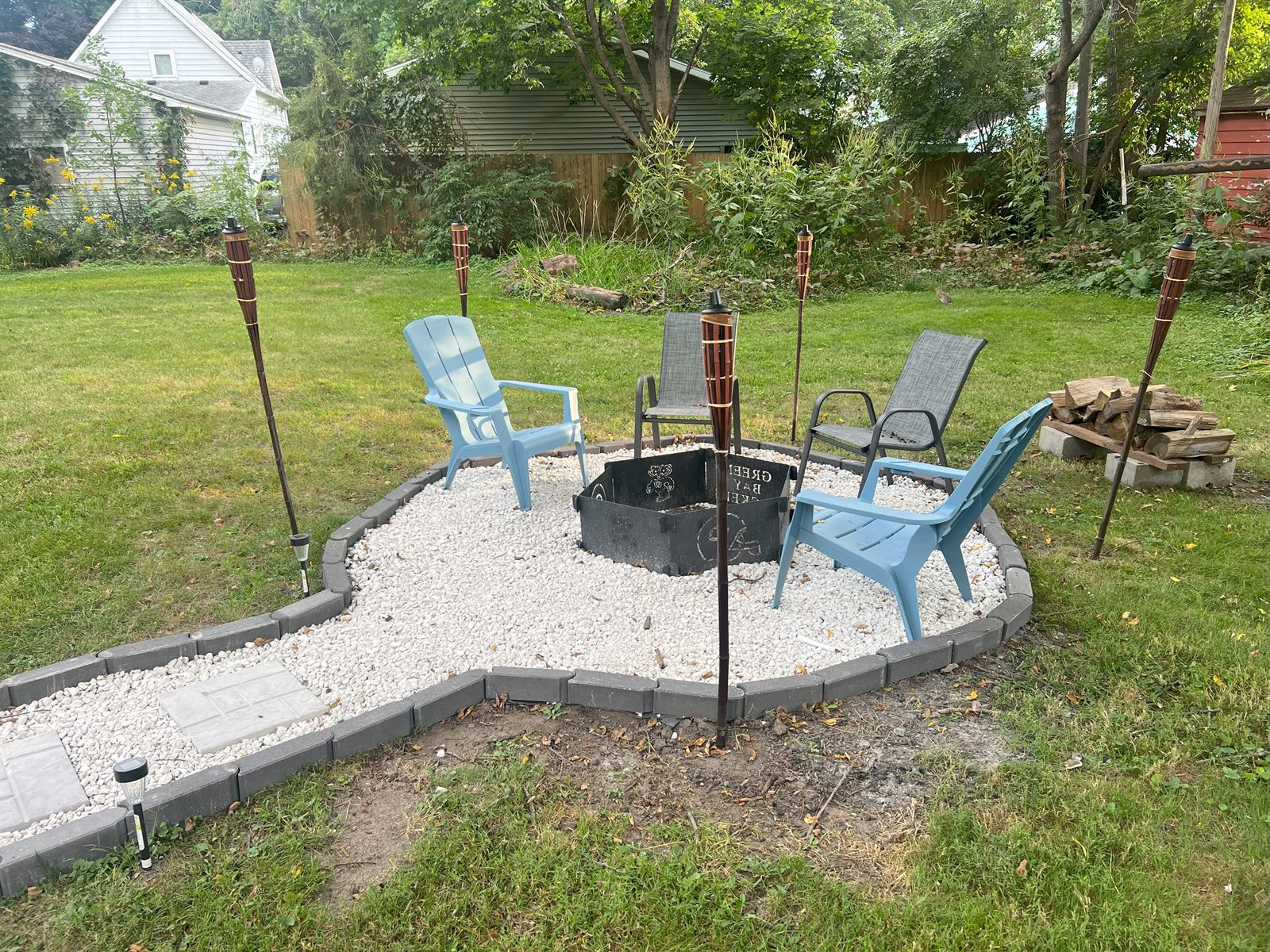 Fire pit with Adirondack chairs at Rose's Place
