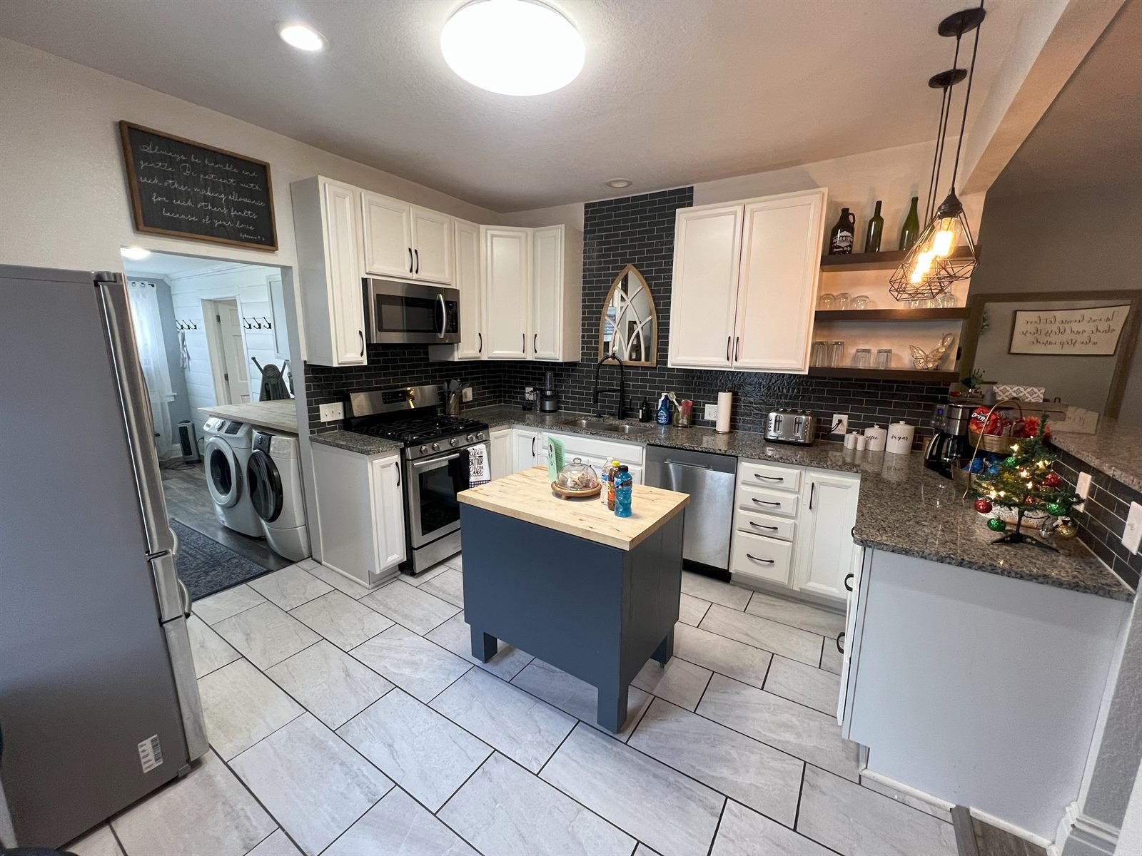 Full kitchen in Rose's Place with stainless appliances